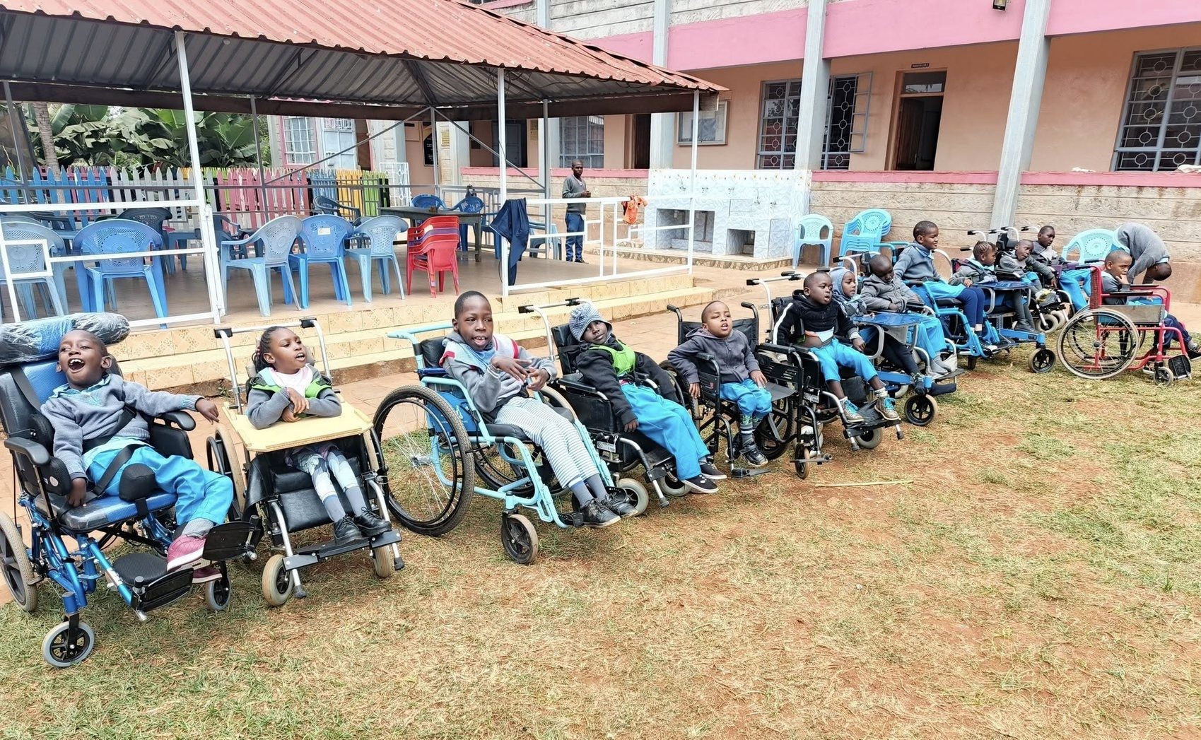 A line of children in wheelchairs at the centre